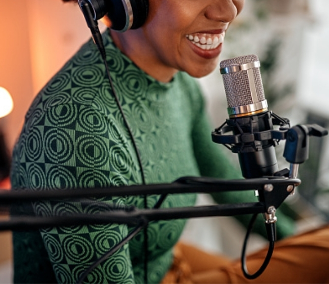 Woman speaking into studio microphone